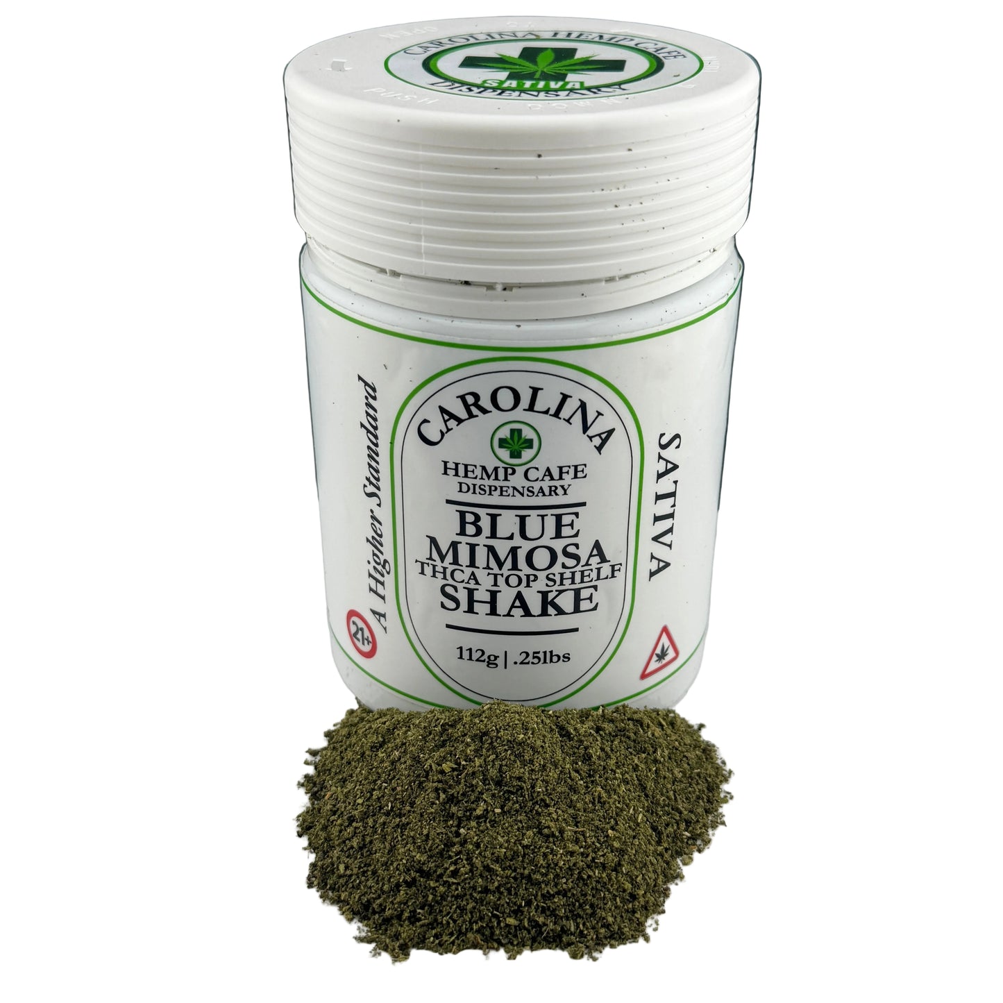 A white plastic jar of Carolina Hemp Cafe Dispensary Blue Mimosa The Top Shell Shake sativa herbal powder, with a small pile of the dark green herbal powder placed in front on a white surface against a dark background.