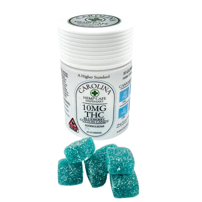 white bottle of 10mg thc gummies by Carolina Hemp cafe. Blueberry Cotton Candy flavor.  10 count bottle with blue cube sugar coated gummies displayed in front of bottle