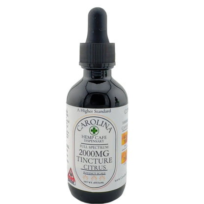 Three bottles of Carolina Hemp Cafe's Full Spectrum THC:CBD Tinctures in different potencies, with dropper caps. The potencies are 400mg Peppermint, 1000mg Cinnamon, and 2000mg Citrus, labeled in white and green packaging.