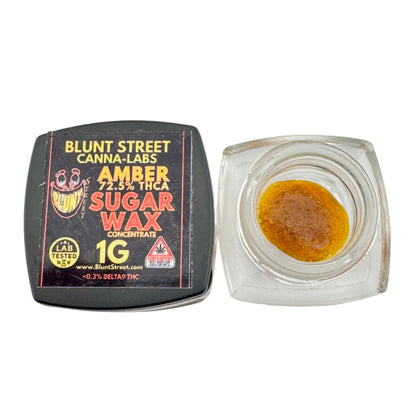 Blunt Street Canna-Labs Amber Sugar Wax Concentrate packaging with wax inside a clear container on a white background.