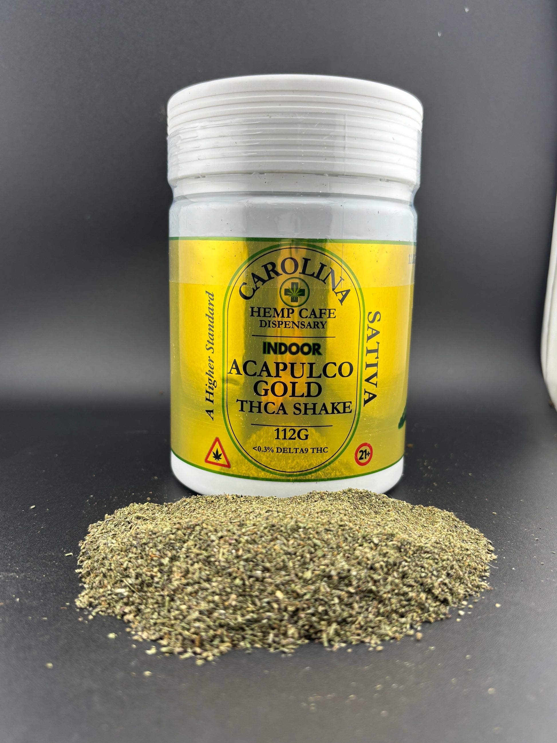 Jar of Carolina Sativa Acapulco Gold Thica Shake on a dark surface