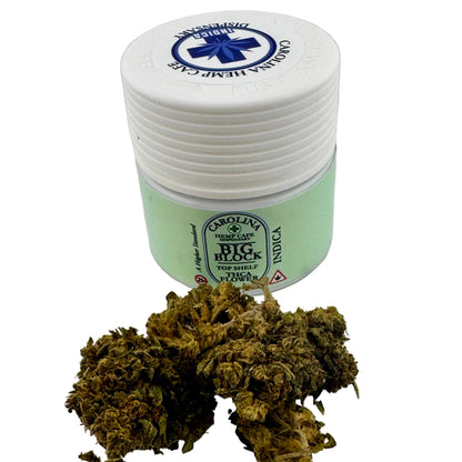 Jar of dried cannabis buds with a branded lid on a white background