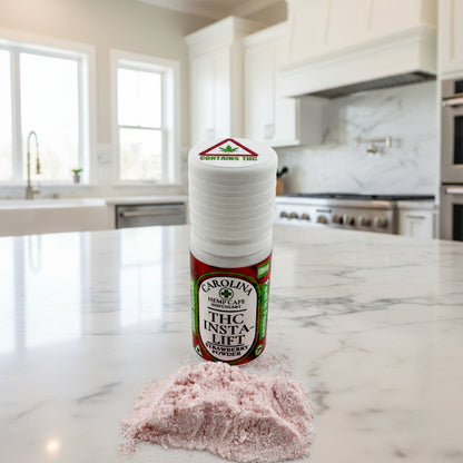Bottle of Carolina Hemp Cafe Dispensary THC Insta-Lift Strawberry Powder on a light gray background