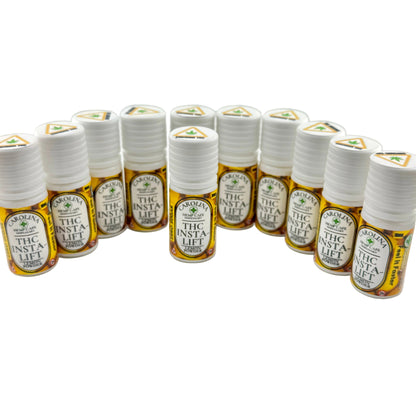 Multiple small bottles labeled 'THC INSTA LIFT' on a white background