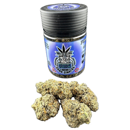 Jar of cannabis buds with a blue label on a gray background