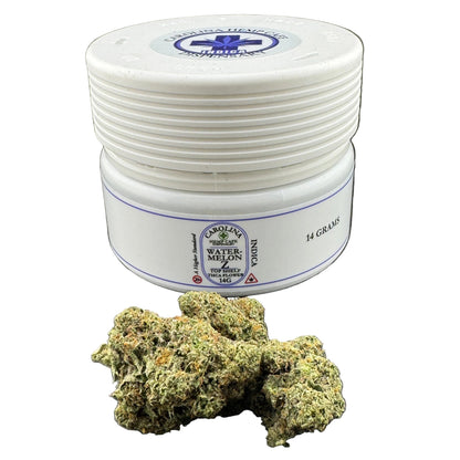 White container with Carolina Hemp Company branding and cannabis buds on a dark surface