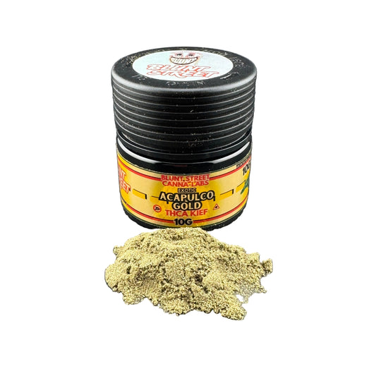 Jar of Acapulco Gold THC Kief with a small pile on a dark surface