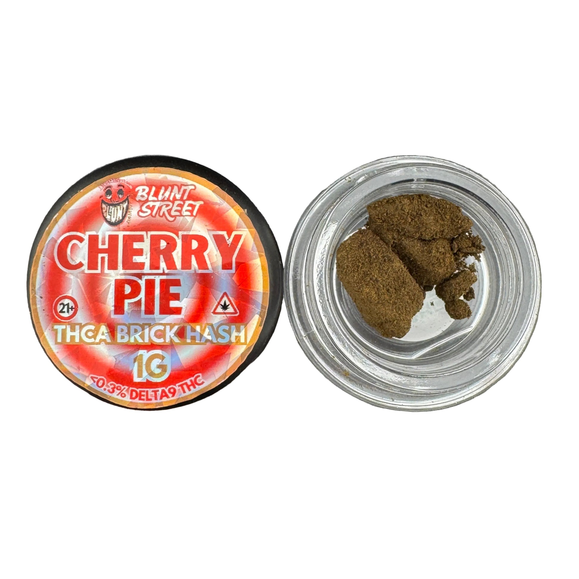An open round plastic jar of Blunt Street Cherry Pie THCA brick hash next to its colorful red and orange label, showing the dark brown hash inside on a gray surface.