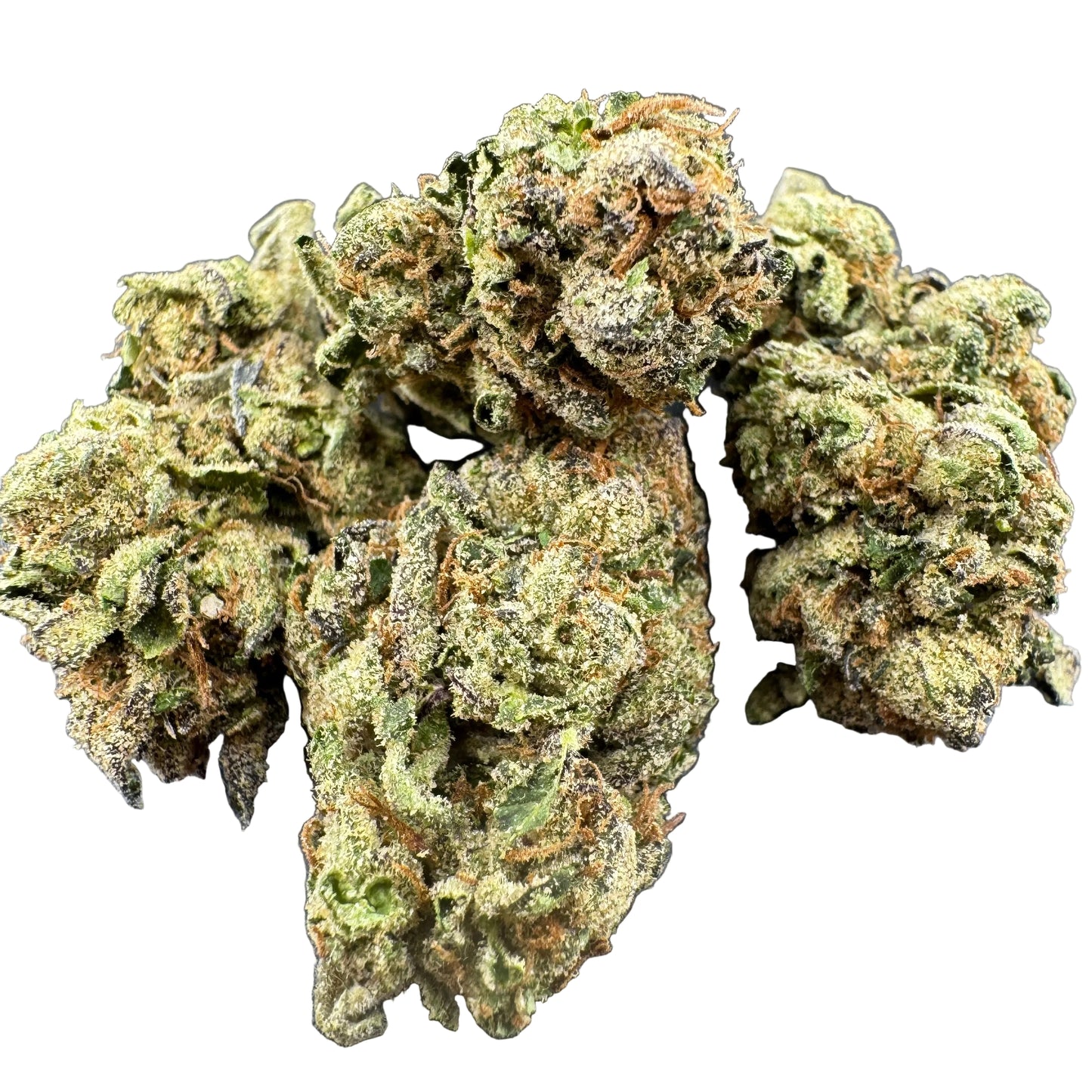 Four dried cannabis buds with dense trichome coverage, showing shades of green, beige, and orange-brown, arranged on a dark textured surface.
