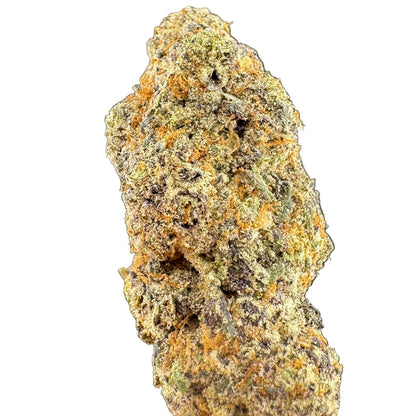 A close-up of a dried cannabis bud showing detailed trichome coverage in orange, green, and brown tones against a dark gray background.