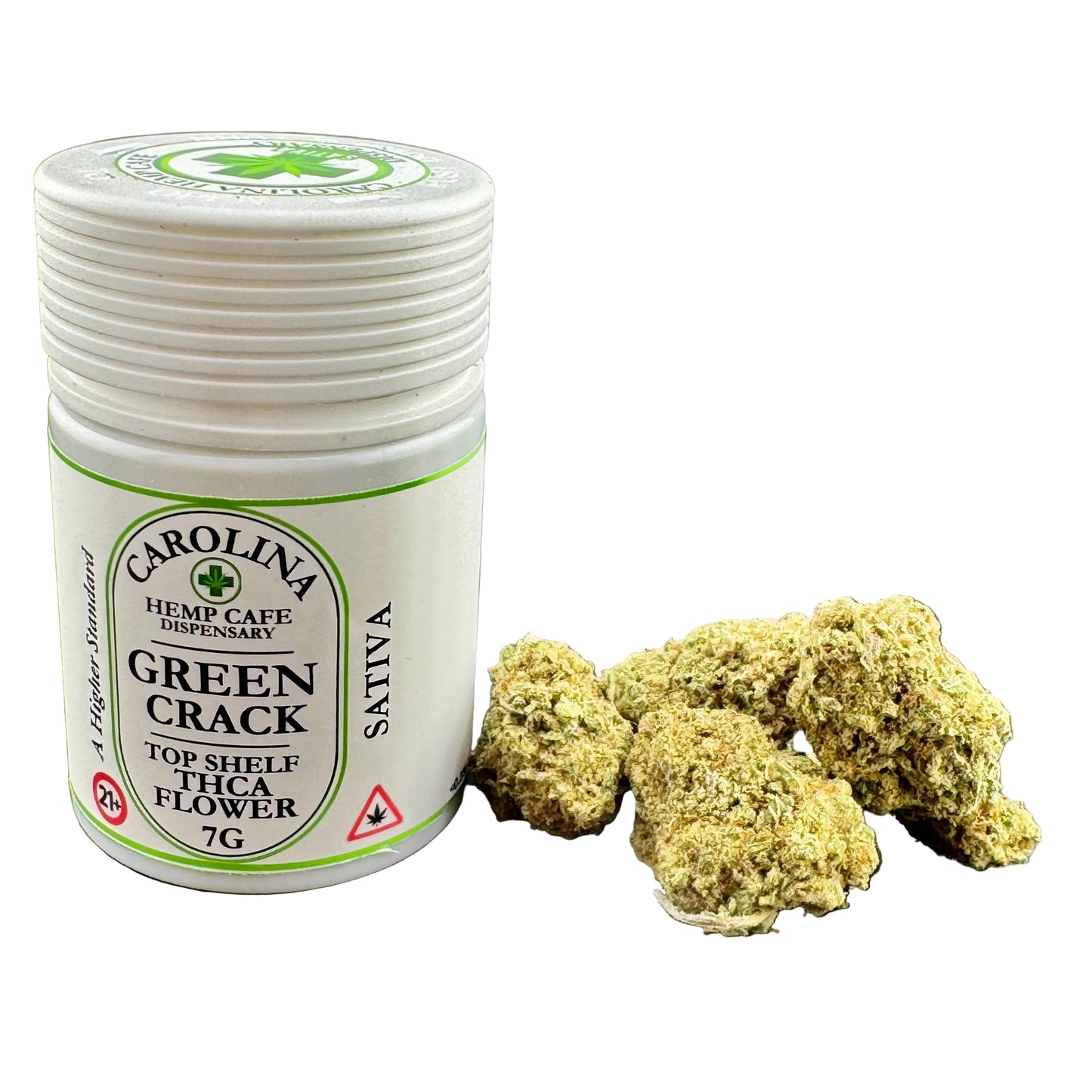 A white plastic jar labeled Carolina Hemp Cafe Dispensary Green Crack Top Shelf THC Flower 7G, shown next to several dried green flower buds on a dark gray background.