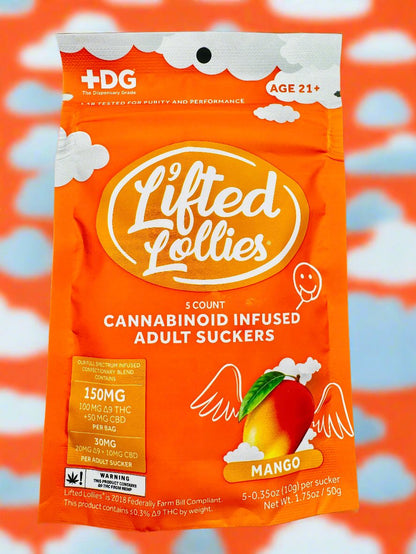 An assortment of Lifted Lollies THC lollipops with various colorful packaging displayed against a vibrant, cloud-filled sky background. Each lollipop has a different flavor label.