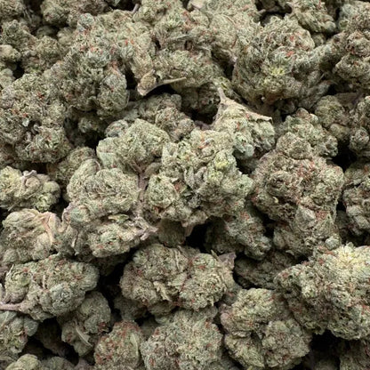 Close-up of green cannabis buds on a clear background