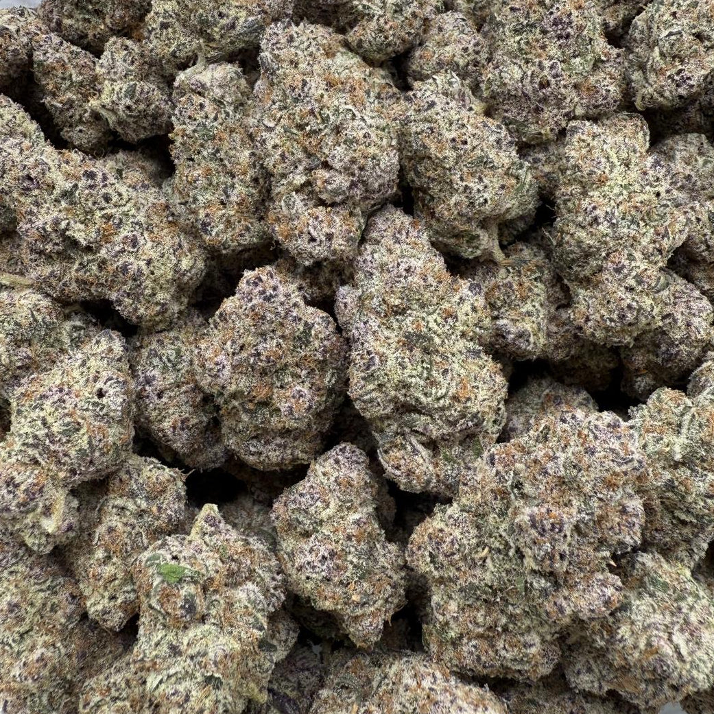 Close-up of a pile of cannabis buds on a white background