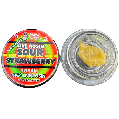 Sour Strawberry Live Rosin container with visible rosin inside on a white background
